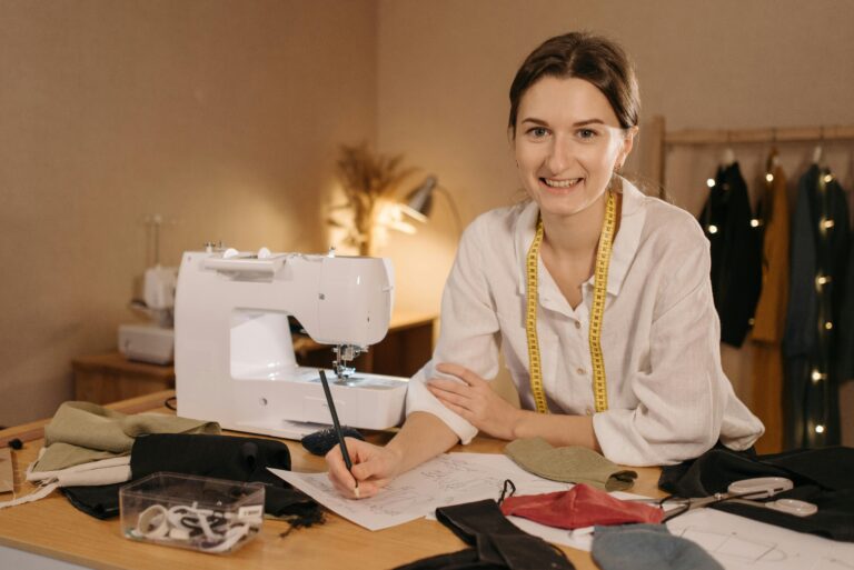 Home-based business owner working on sewing projects in a home office, highlighting the need for separate business insurance coverage not included in standard homeowner's policies.